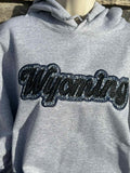 Wyoming black sparkles with blue western applique Embroidery Hoodie