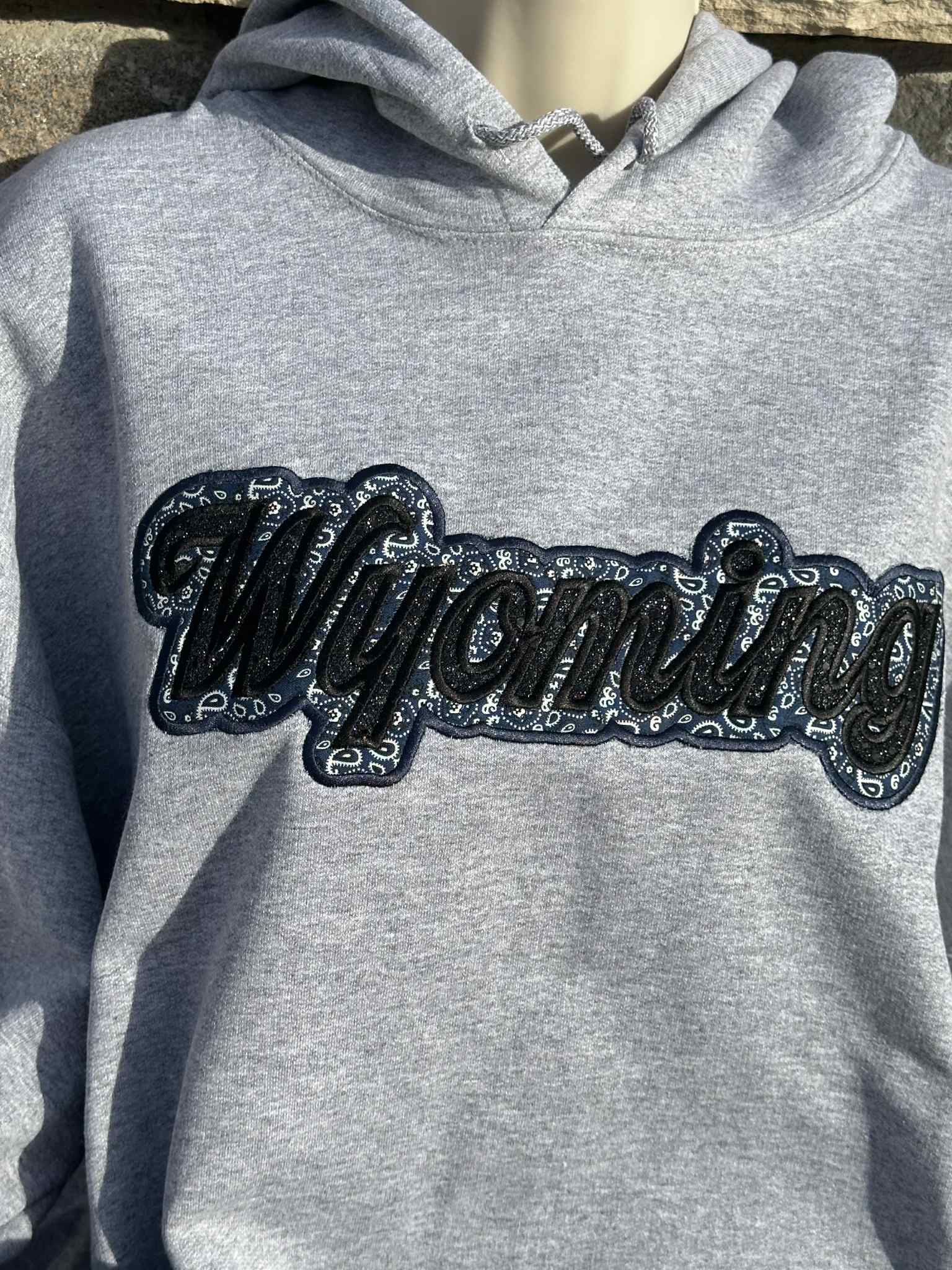 Wyoming black sparkles with blue western applique Embroidery Hoodie