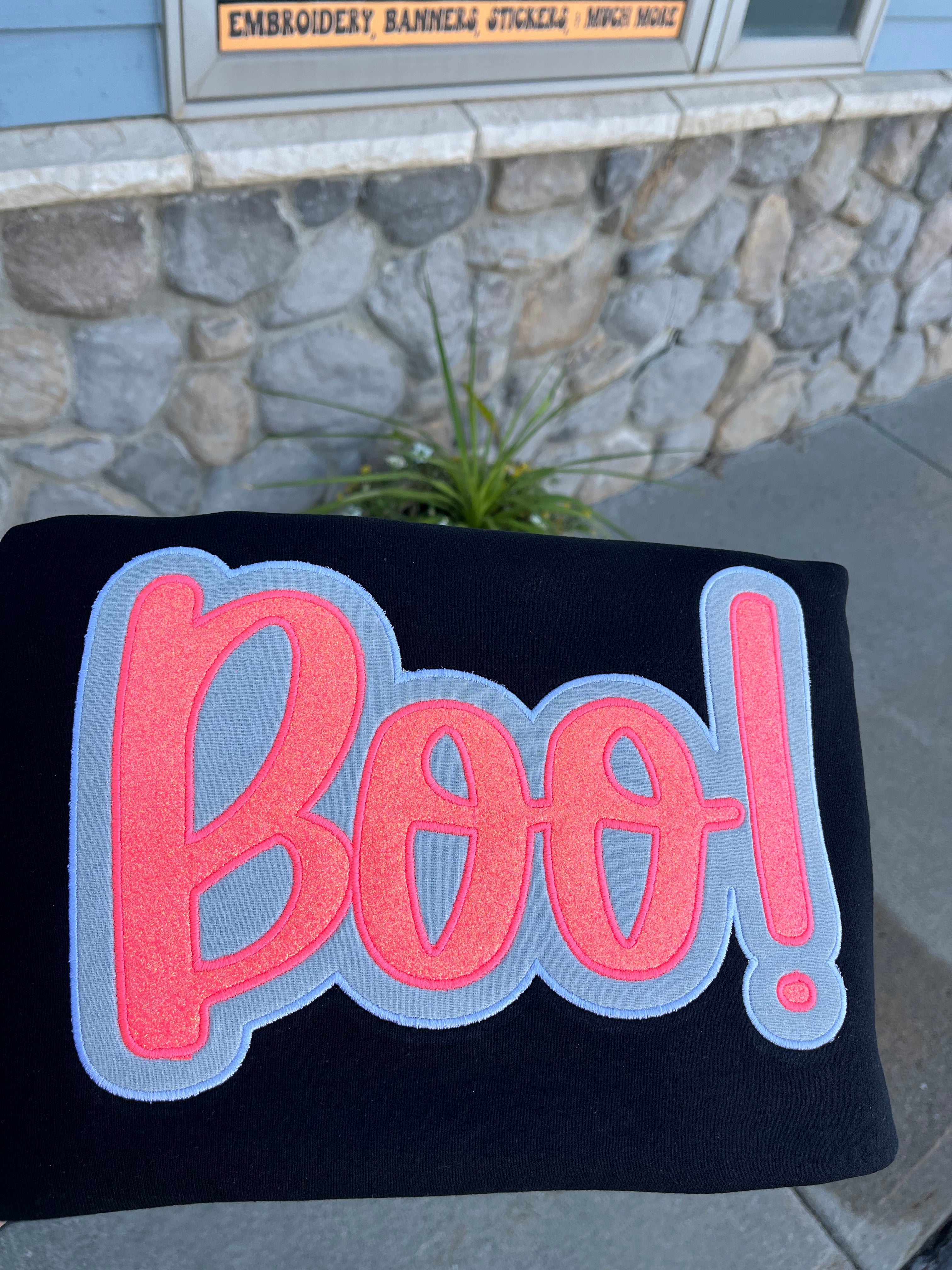 Pink and white sparkly applied BOO embroidered on Black Crewneck