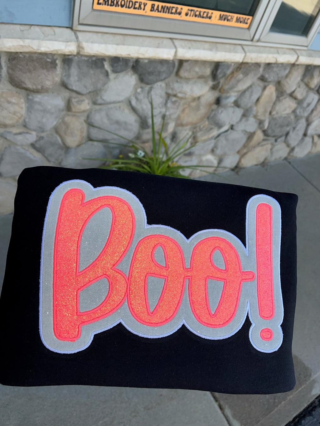 Pink and white sparkly applied BOO embroidered on Black Crewneck