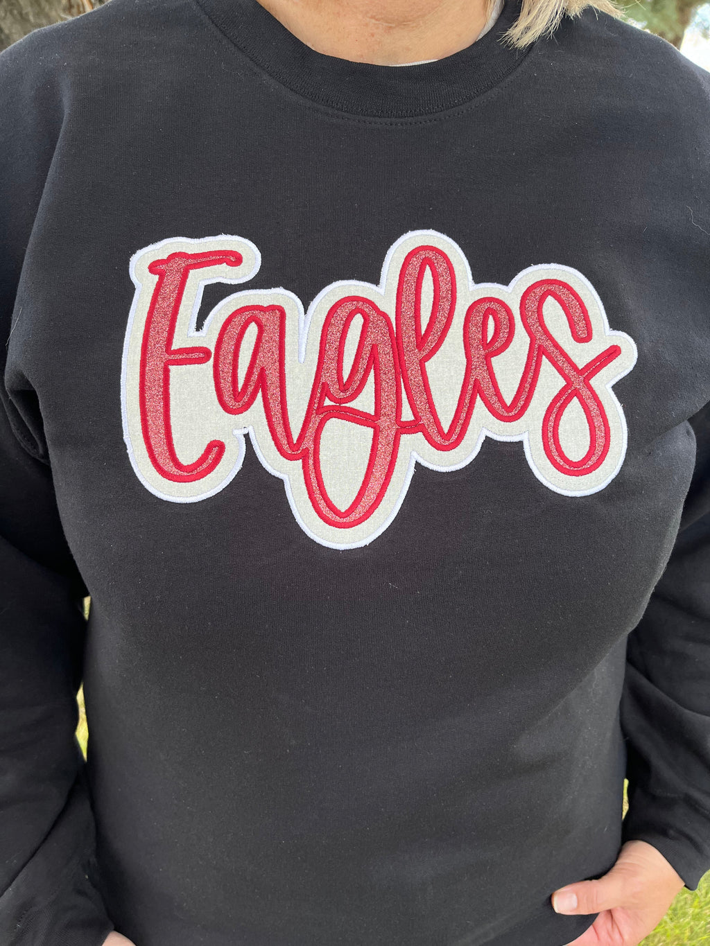 Eagles Maroon and White Glitter Applique Embroidery on Black Crewneck